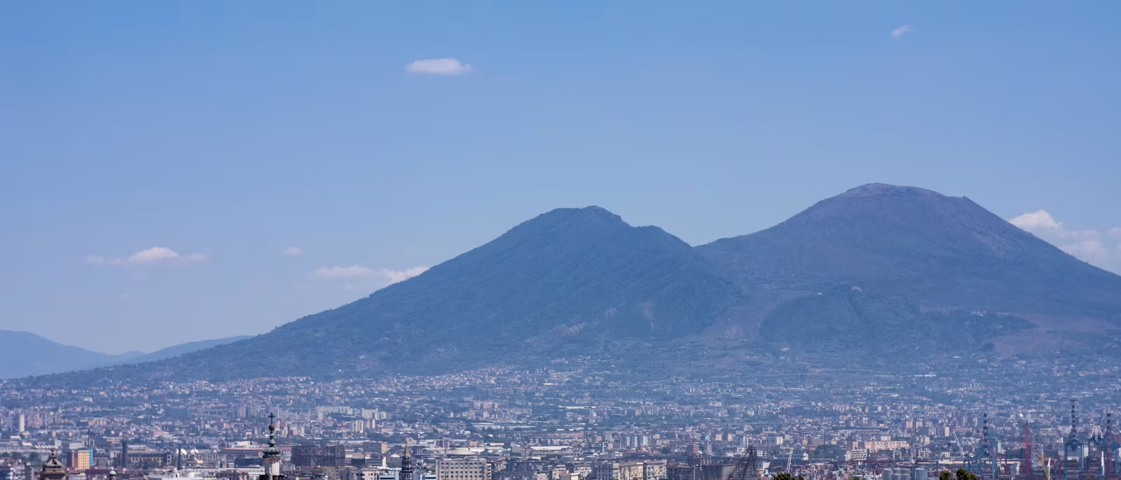 Vesuvius over the rooftops of Naples on a clear day