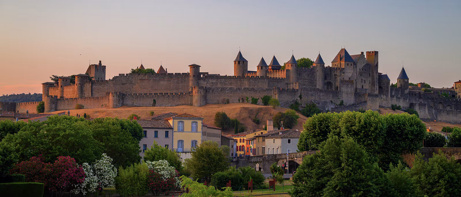 The walled Cité of Carcassonne above the lower town at sunset